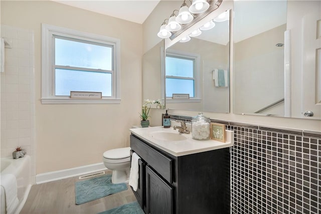 2400 Lane Ave, Anderson, SC 29621 - bathroom with toilet, vanity, wood finished floors, shower / washtub combination, and baseboards