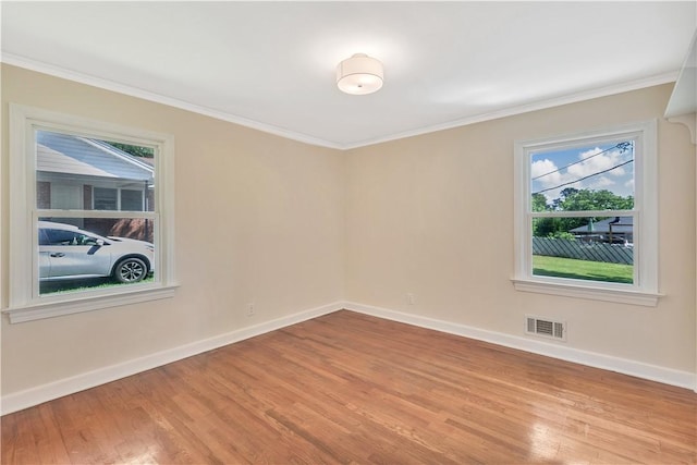 2400 Lane Ave, Anderson, SC 29621 - unfurnished room with wood finished floors, plenty of natural light, crown molding, and baseboards