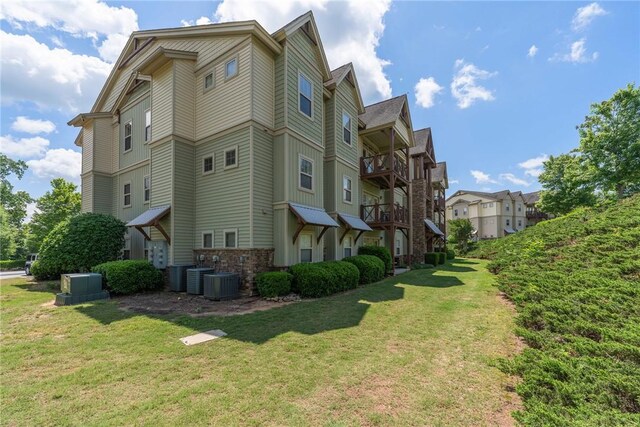 1523 Gadwell Way, Seneca, SC 29678 - view of property exterior featuring a lawn, a balcony, and central AC