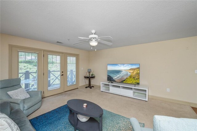 1523 Gadwell Way, Seneca, SC 29678 - living room featuring french doors, carpet, a ceiling fan, and a textured ceiling