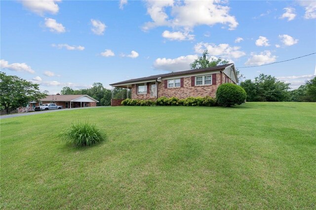 134 Grasshopper Hill Rd, Pickens, SC 29671 - ranch-style home featuring a front lawn and brick siding