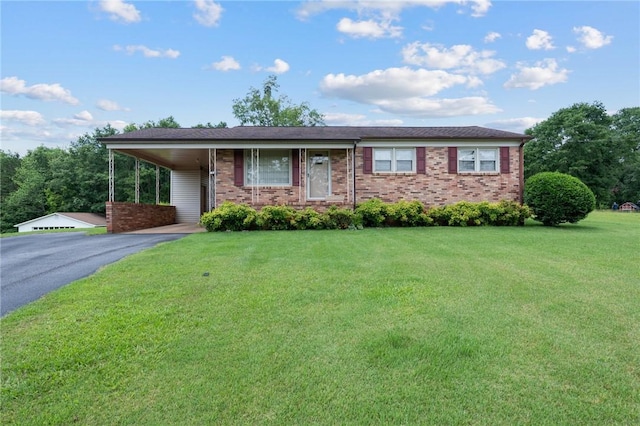 134 Grasshopper Hill Rd, Pickens, SC 29671 - single story home with asphalt driveway, a front lawn, a carport, and brick siding