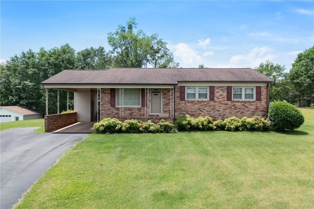 134 Grasshopper Hill Rd, Pickens, SC 29671 - single story home with driveway, brick siding, an attached carport, and a front lawn