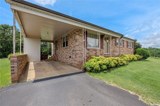 134 Grasshopper Hill Rd, Pickens, SC 29671 - view of front of property with a front lawn, a carport, asphalt driveway, and brick siding