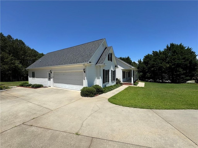 106 Dewars Trl, Anderson, SC 29621 - view of side of home with a lawn, concrete driveway, a garage, and a shingled roof