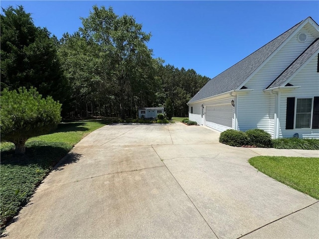 106 Dewars Trl, Anderson, SC 29621 - view of property exterior with driveway, a shingled roof, and a garage