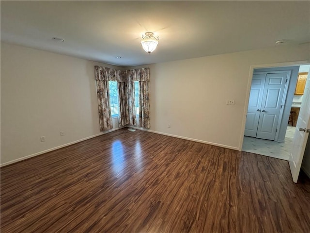 106 Dewars Trl, Anderson, SC 29621 - unfurnished room with dark wood-style floors, baseboards, and a smoke detector