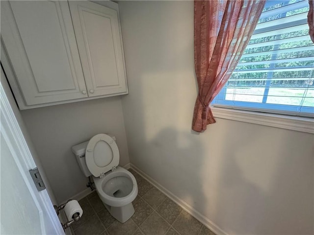 106 Dewars Trl, Anderson, SC 29621 - bathroom featuring baseboards, toilet, and tile patterned floors