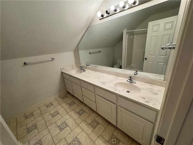 106 Dewars Trl, Anderson, SC 29621 - bathroom featuring double vanity, baseboards, lofted ceiling, a shower, and toilet