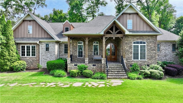 122 Langwell Dr, Anderson, SC 29621 - craftsman-style home with board and batten siding, stairs, a front yard, stone siding, and french doors