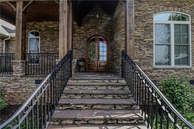 122 Langwell Dr, Anderson, SC 29621 - view of exterior entry with stone siding, a porch, and french doors