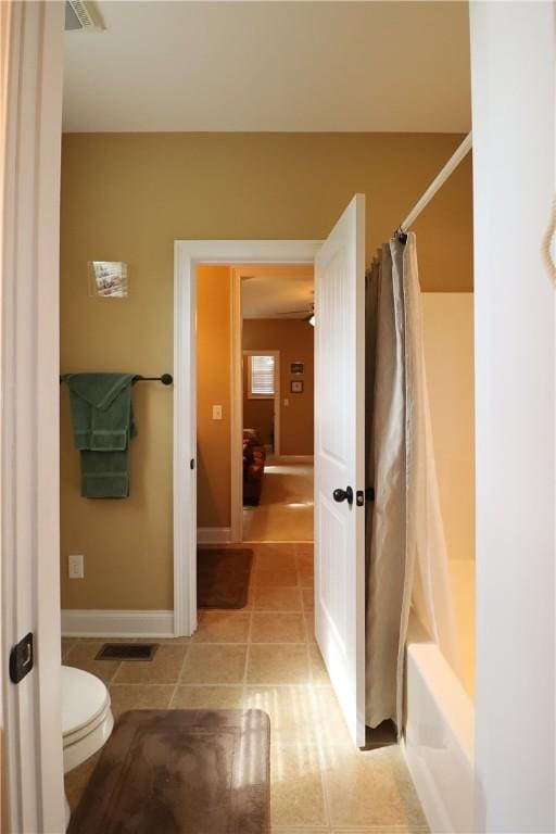 122 Langwell Dr, Anderson, SC 29621 - full bath with tile patterned floors, toilet, shower / bath combination with curtain, and baseboards