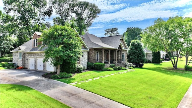 122 Langwell Dr, Anderson, SC 29621 - view of front of home with driveway, a front yard, a porch, an attached garage, and stone siding