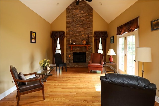 122 Langwell Dr, Anderson, SC 29621 - living room featuring light wood finished floors, a fireplace, baseboards, high vaulted ceiling, and a ceiling fan