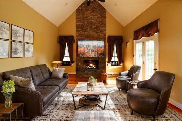 122 Langwell Dr, Anderson, SC 29621 - living area featuring a stone fireplace, wood finished floors, baseboards, and high vaulted ceiling