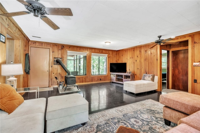 466 Whetstone Rd, Mountain Rest, SC 29664 - living area with ceiling fan, a wood stove, wooden walls, and wood finished floors