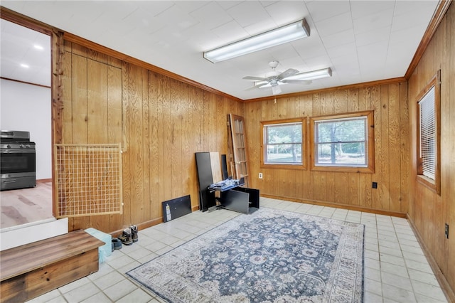 466 Whetstone Rd, Mountain Rest, SC 29664 - sitting room with wooden walls, ceiling fan, ornamental molding, light tile patterned flooring, and baseboards