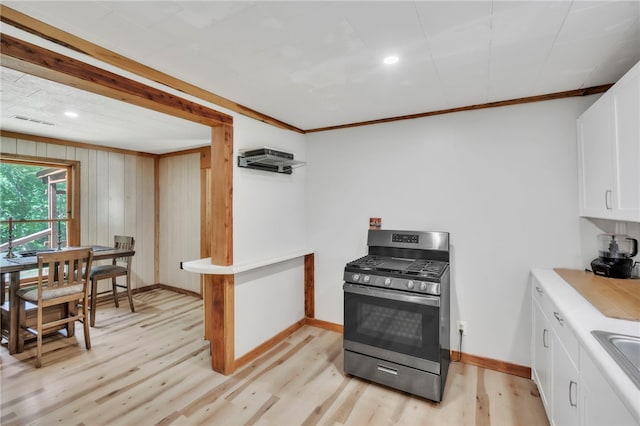 466 Whetstone Rd, Mountain Rest, SC 29664 - kitchen featuring stainless steel range with gas stovetop, light wood-style floors, white cabinetry, baseboards, and light countertops