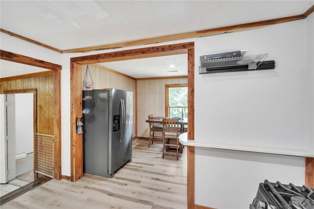466 Whetstone Rd, Mountain Rest, SC 29664 - kitchen with appliances with stainless steel finishes, light wood finished floors, wood walls, and ornamental molding