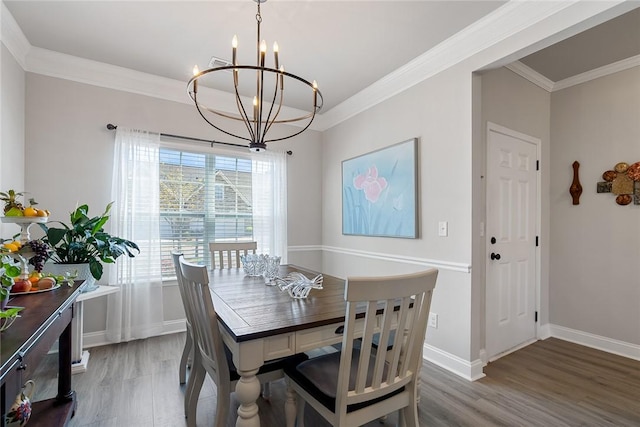 133 Shipyard Cir, Anderson, SC 29621 - dining area with a chandelier, crown molding, baseboards, and light wood-style flooring