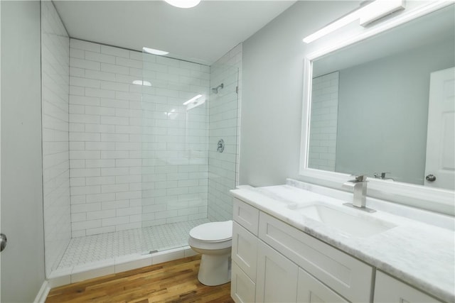 425 Lakewood Dr, Townville, SC 29689 - full bathroom with toilet, tiled shower, vanity, and wood finished floors