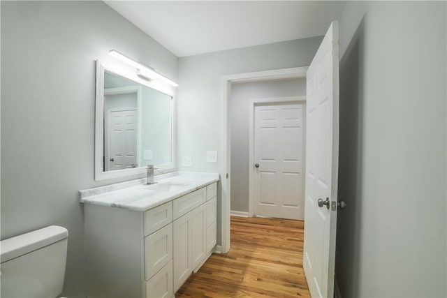 425 Lakewood Dr, Townville, SC 29689 - bathroom featuring wood finished floors, vanity, and toilet