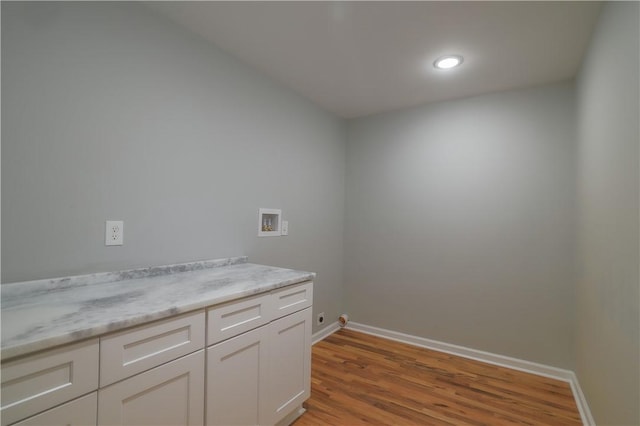 425 Lakewood Dr, Townville, SC 29689 - washroom featuring washer hookup, light wood-style flooring, baseboards, cabinet space, and recessed lighting