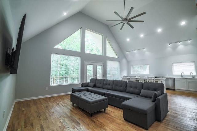 425 Lakewood Dr, Townville, SC 29689 - living room featuring ceiling fan, high vaulted ceiling, french doors, light wood-type flooring, and baseboards
