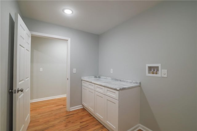 425 Lakewood Dr, Townville, SC 29689 - washroom featuring washer hookup, light wood-style flooring, baseboards, recessed lighting, and cabinet space
