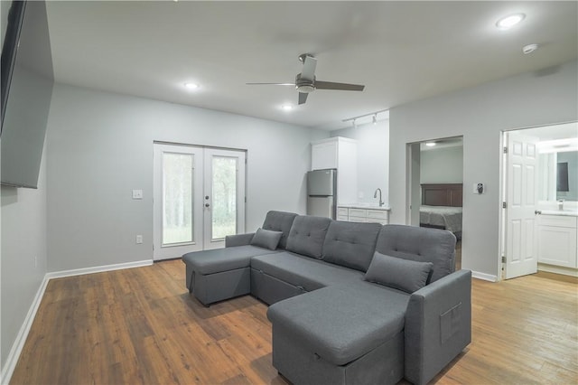 425 Lakewood Dr, Townville, SC 29689 - living room featuring ceiling fan, french doors, light wood-type flooring, baseboards, and recessed lighting