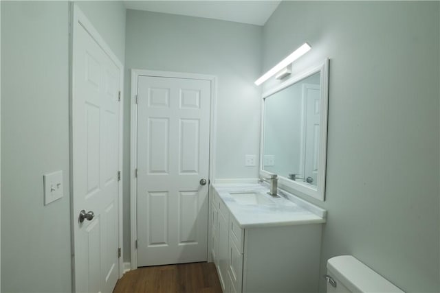 425 Lakewood Dr, Townville, SC 29689 - bathroom with vanity, toilet, and wood finished floors