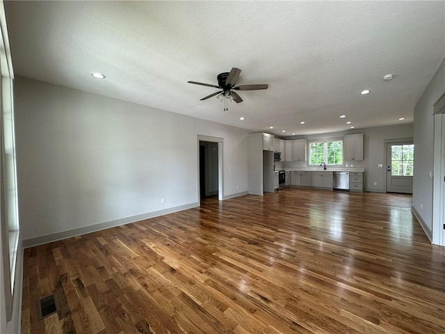 190 Jefferson Pl, Walhalla, SC 29691 - unfurnished living room with wood finished floors, a ceiling fan, recessed lighting, and a textured ceiling