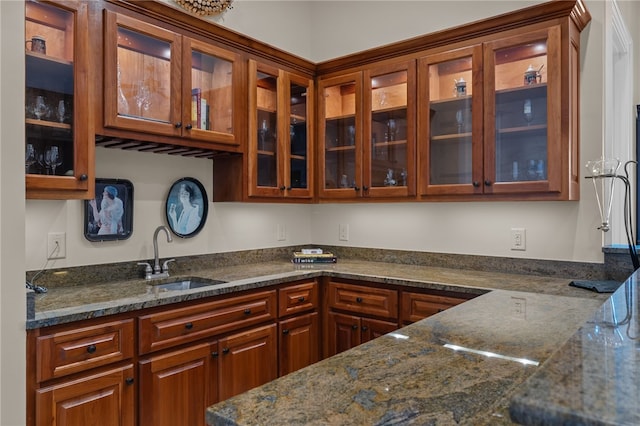 117 Misty Water Loop, Sunset, SC 29685 - kitchen featuring a sink, glass insert cabinets, and dark stone countertops