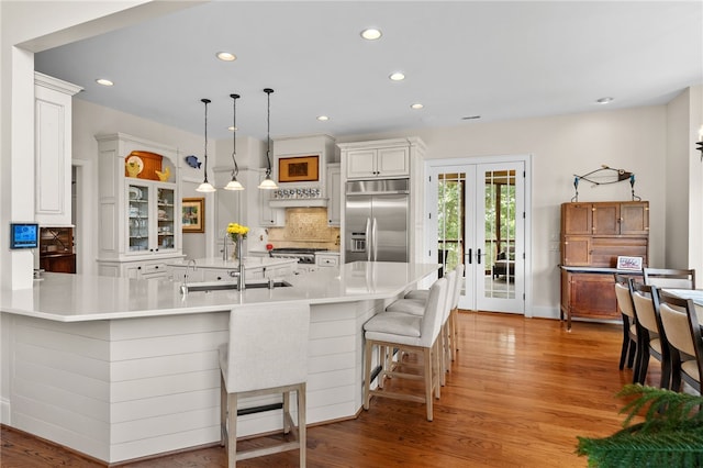 117 Misty Water Loop, Sunset, SC 29685 - kitchen with built in fridge, a sink, decorative backsplash, recessed lighting, and light wood-style flooring