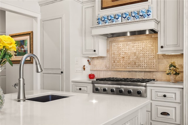117 Misty Water Loop, Sunset, SC 29685 - kitchen featuring stainless steel gas stovetop, a sink, light countertops, and backsplash