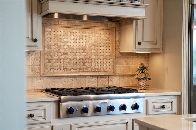 117 Misty Water Loop, Sunset, SC 29685 - kitchen with stainless steel gas stovetop, light countertops, backsplash, and custom range hood