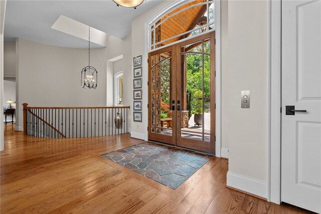 117 Misty Water Loop, Sunset, SC 29685 - entryway featuring wood-type flooring, french doors, baseboards, and a chandelier