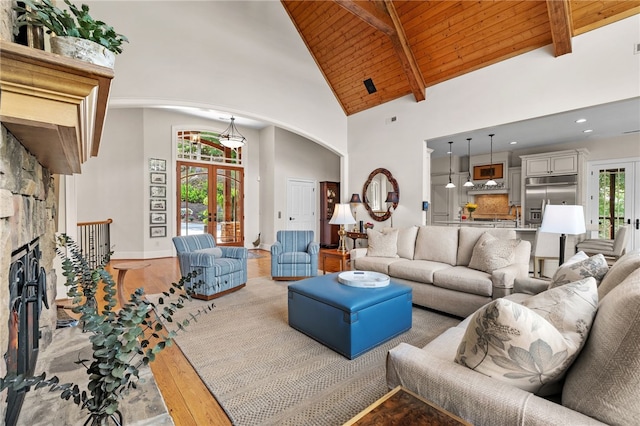117 Misty Water Loop, Sunset, SC 29685 - living area with arched walkways, high vaulted ceiling, french doors, wooden ceiling with exposed beams, and wood finished floors