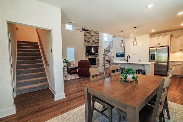 117 Founders Blvd, Central, SC 29630 - dining space featuring dark wood-type flooring, stairway, baseboards, recessed lighting, and a fireplace