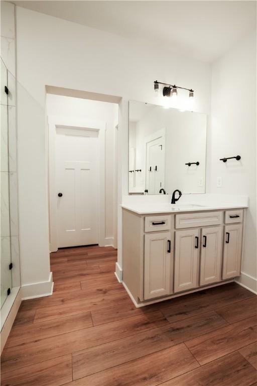 117 Founders Blvd, Central, SC 29630 - full bathroom featuring a marble finish shower, vanity, wood finished floors, and baseboards
