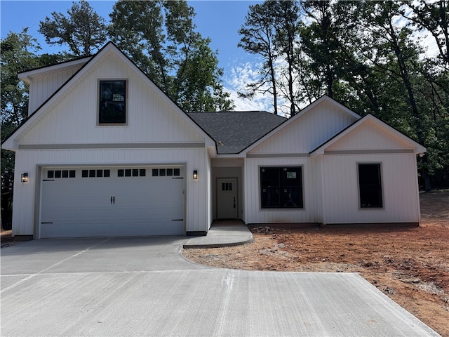 629 Mountain View Rd, Williamston, SC 29697 - modern inspired farmhouse with concrete driveway, roof with shingles, and an attached garage