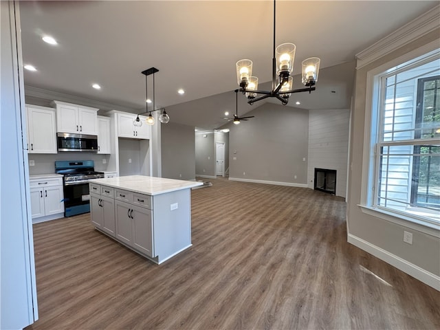 629 Mountain View Rd, Williamston, SC 29697 - kitchen with appliances with stainless steel finishes, baseboards, a chandelier, white cabinets, and wood finished floors