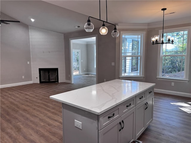 629 Mountain View Rd, Williamston, SC 29697 - kitchen featuring baseboards, dark wood finished floors, healthy amount of natural light, and crown molding