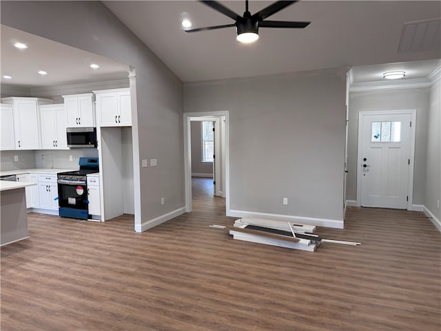 629 Mountain View Rd, Williamston, SC 29697 - kitchen featuring appliances with stainless steel finishes, baseboards, ceiling fan, wood finished floors, and crown molding