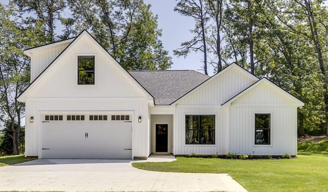 629 Mountain View Rd, Williamston, SC 29697 - modern farmhouse style home featuring a shingled roof, a front lawn, driveway, and board and batten siding