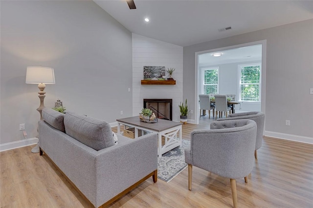 629 Mountain View Rd, Williamston, SC 29697 - living area with light wood-type flooring, a large fireplace, lofted ceiling, and recessed lighting