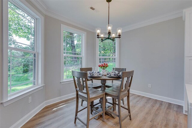 629 Mountain View Rd, Williamston, SC 29697 - dining area featuring healthy amount of natural light, light wood-style flooring, a chandelier, and ornamental molding