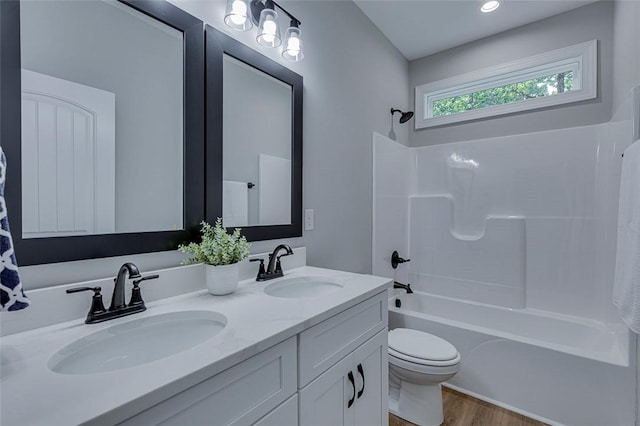 629 Mountain View Rd, Williamston, SC 29697 - bathroom featuring shower / bathtub combination, double vanity, and wood finished floors