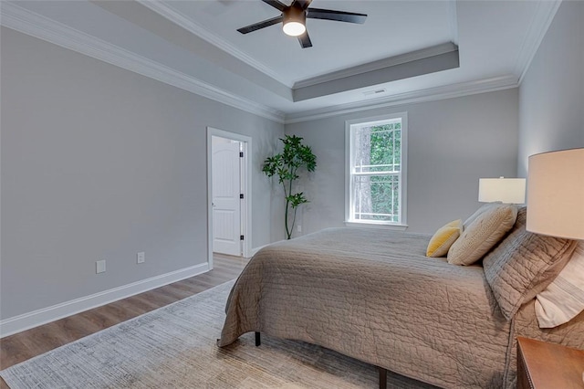 629 Mountain View Rd, Williamston, SC 29697 - bedroom with wood finished floors, a tray ceiling, crown molding, and a ceiling fan