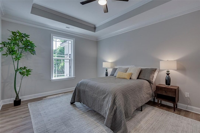 629 Mountain View Rd, Williamston, SC 29697 - bedroom with light wood finished floors, a raised ceiling, crown molding, and ceiling fan